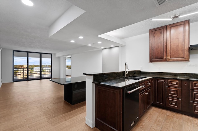 kitchen with dishwasher, light wood-type flooring, sink, and kitchen peninsula