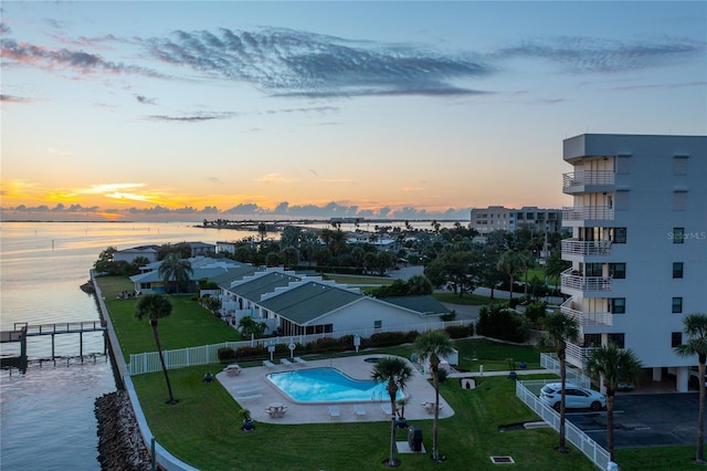 aerial view at dusk with a water view