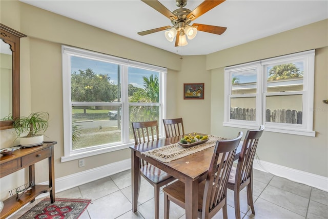 dining room featuring light tile patterned floors and ceiling fan