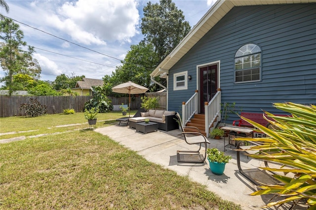 view of yard with an outdoor living space and a patio area