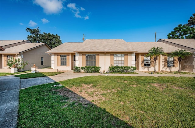 ranch-style house featuring a front lawn