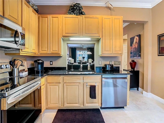 kitchen with sink, light tile patterned floors, crown molding, and stainless steel appliances