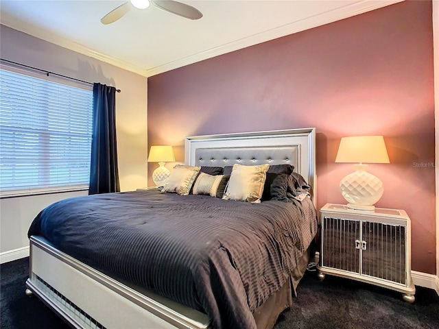 bedroom featuring dark colored carpet, crown molding, baseboards, and ceiling fan