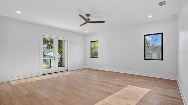 spare room with light wood-style floors, baseboards, visible vents, and recessed lighting