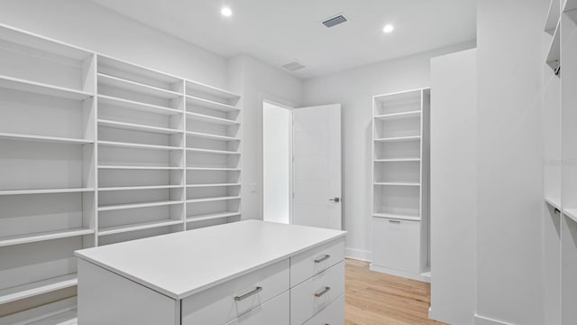 spacious closet with visible vents and light wood-style flooring