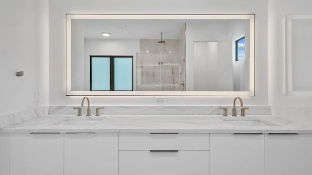 full bathroom with plenty of natural light, a sink, and a shower stall