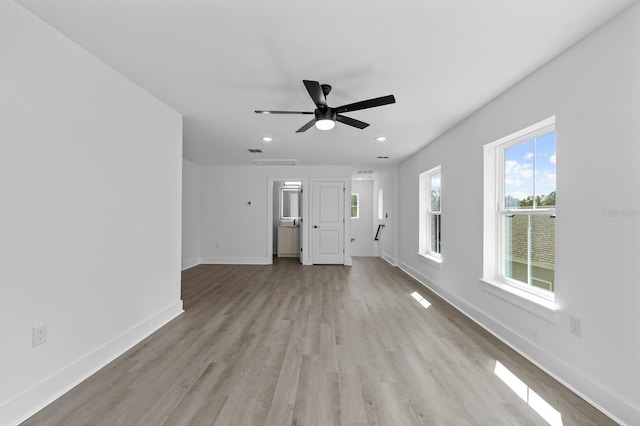 unfurnished living room with light hardwood / wood-style flooring and ceiling fan