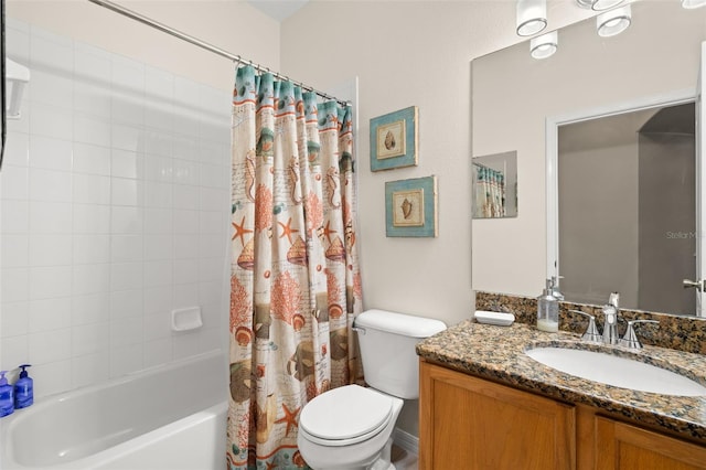 full bathroom featuring vanity, shower / bath combination with curtain, and toilet