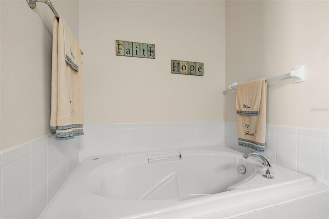 bathroom featuring a relaxing tiled tub