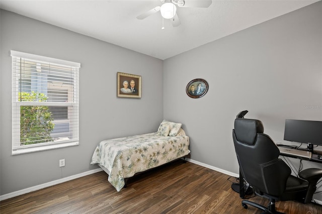 bedroom with dark wood-type flooring and ceiling fan