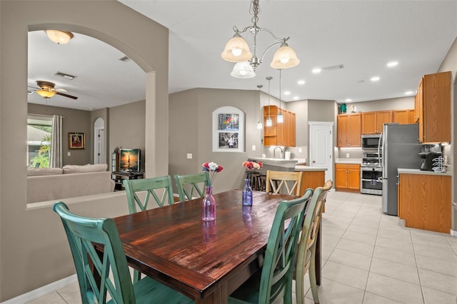 dining room with light tile patterned floors and ceiling fan