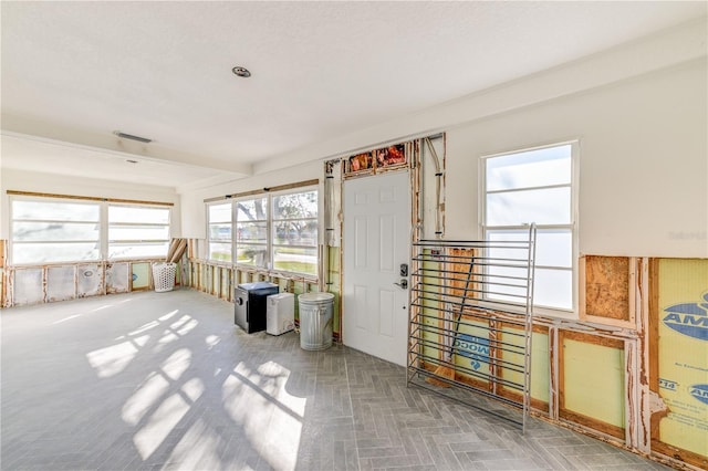 sunroom with beam ceiling