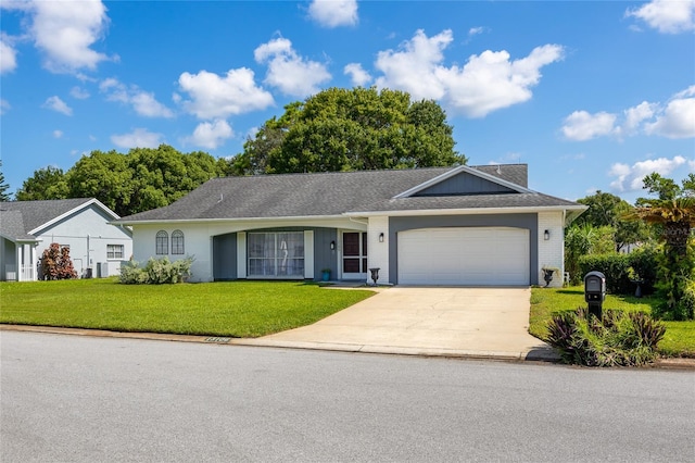 single story home featuring a garage and a front yard