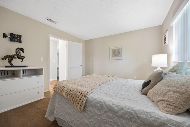 bedroom with carpet and multiple windows