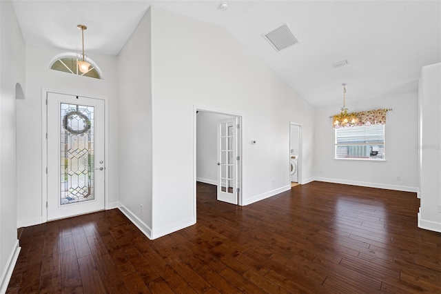 1008 Blue Heron Way, Tarpon Springs, FL 34689 - foyer entrance with high vaulted ceiling, a chandelier, healthy amount of natural light, hardwood / wood-style floors, and baseboards