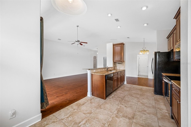 kitchen with a ceiling fan, dishwasher, brown cabinets, a peninsula, and stainless steel electric stove