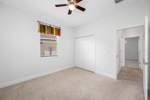 unfurnished bedroom featuring light carpet, visible vents, and baseboards