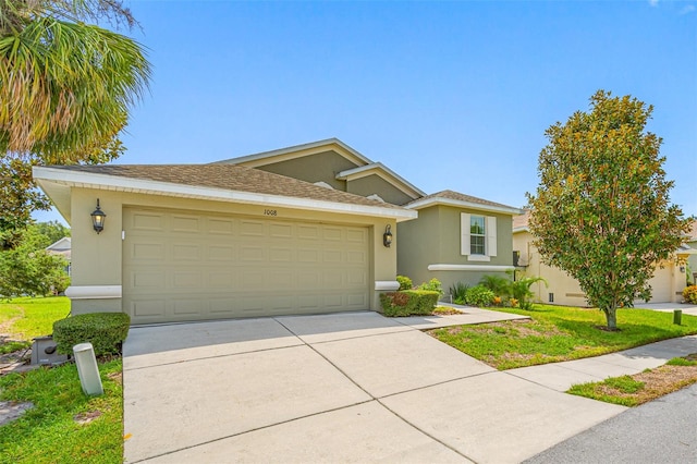 ranch-style house featuring a shingled roof, driveway, an attached garage, and stucco siding