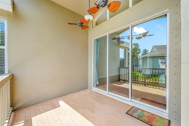 balcony featuring ceiling fan