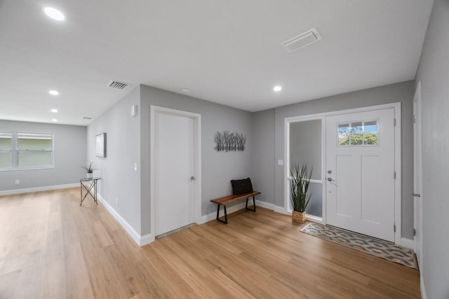 entrance foyer with light wood-style floors, recessed lighting, visible vents, and baseboards