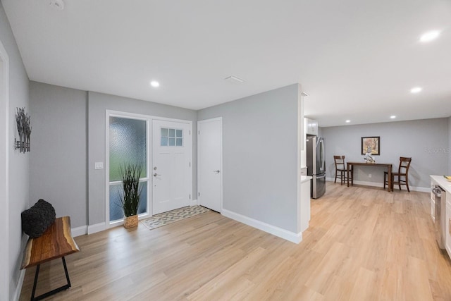 entrance foyer featuring recessed lighting, baseboards, and light wood finished floors