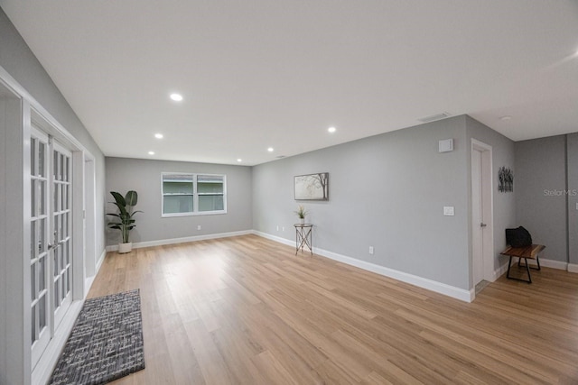 interior space featuring light wood-style floors, recessed lighting, visible vents, and baseboards