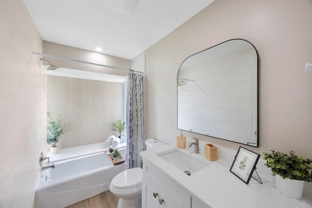 bathroom featuring shower / tub combo, vanity, toilet, and wood finished floors