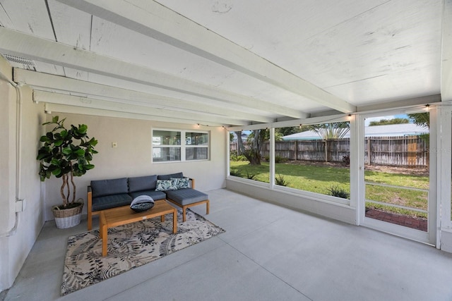 sunroom with beam ceiling