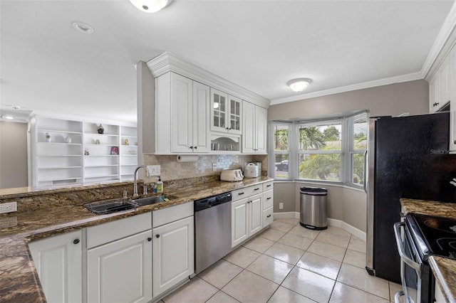 kitchen with crown molding, white cabinets, and appliances with stainless steel finishes