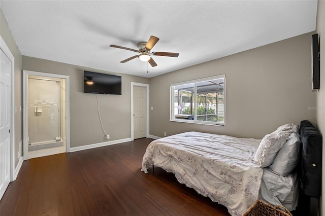 bedroom with a textured ceiling, ceiling fan, and dark hardwood / wood-style floors