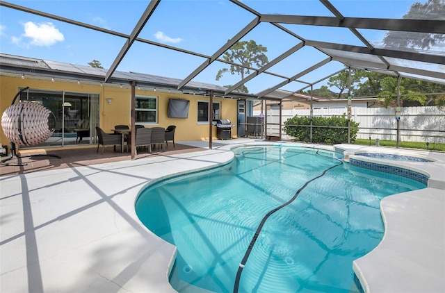 view of pool featuring grilling area, a patio, a lanai, and fence