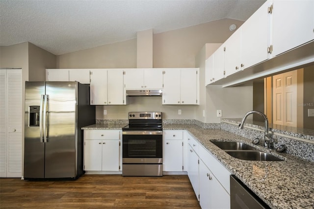 kitchen featuring light stone counters, white cabinets, appliances with stainless steel finishes, and sink