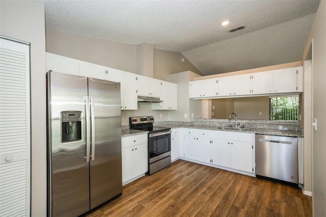 kitchen with sink, white cabinetry, appliances with stainless steel finishes, and lofted ceiling