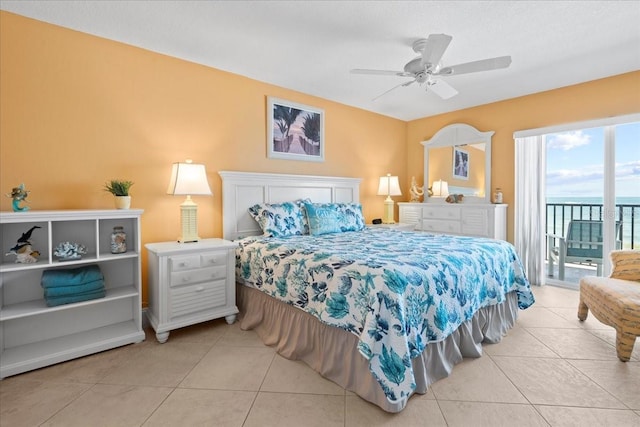 bedroom featuring access to outside, a ceiling fan, and light tile patterned flooring