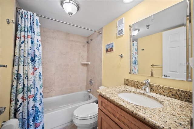 bathroom featuring toilet, shower / bath combo, visible vents, and vanity