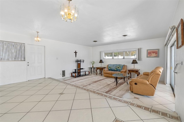 living room with an inviting chandelier and light tile patterned floors