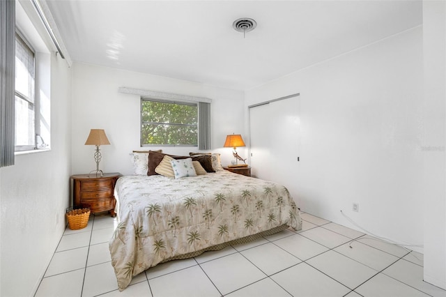 bedroom featuring light tile patterned floors