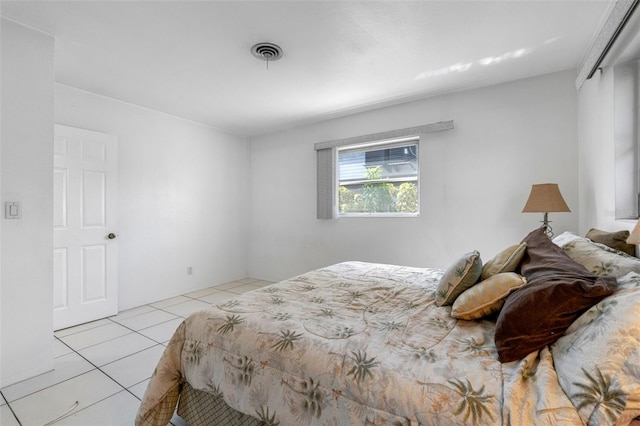 tiled bedroom featuring a closet