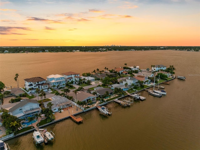 aerial view at dusk with a water view