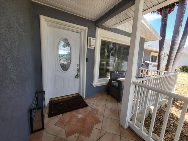 3912 Fontainebleau Dr, Tampa, FL 33634 - doorway to property featuring stucco siding