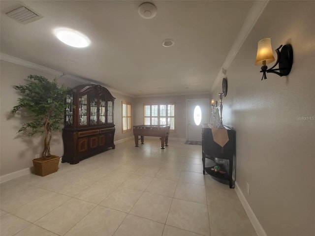 3912 Fontainebleau Dr, Tampa, FL 33634 - corridor featuring baseboards, visible vents, light tile patterned flooring, and crown molding
