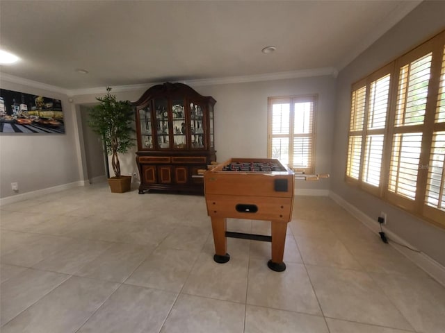 playroom with light tile patterned floors and ornamental molding