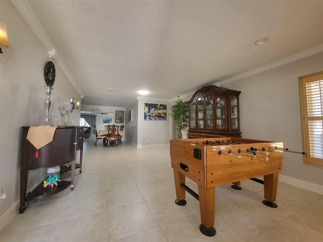 3912 Fontainebleau Dr, Tampa, FL 33634 - rec room with light tile patterned flooring, ornamental molding, and baseboards