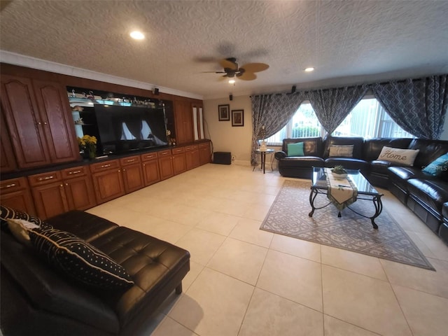 living room featuring ceiling fan, a textured ceiling, and light tile patterned floors