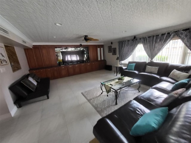 3912 Fontainebleau Dr, Tampa, FL 33634 - living area with baseboards, visible vents, light tile patterned floors, and a textured ceiling