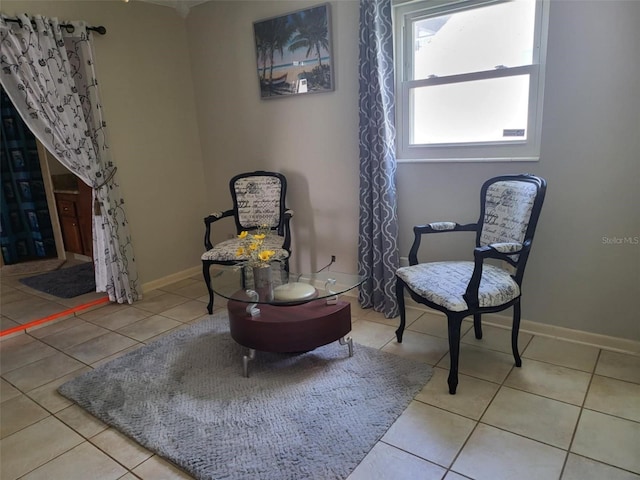 sitting room featuring light tile patterned flooring