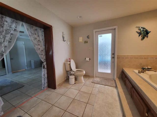 bathroom featuring toilet, tile patterned floors, and vanity