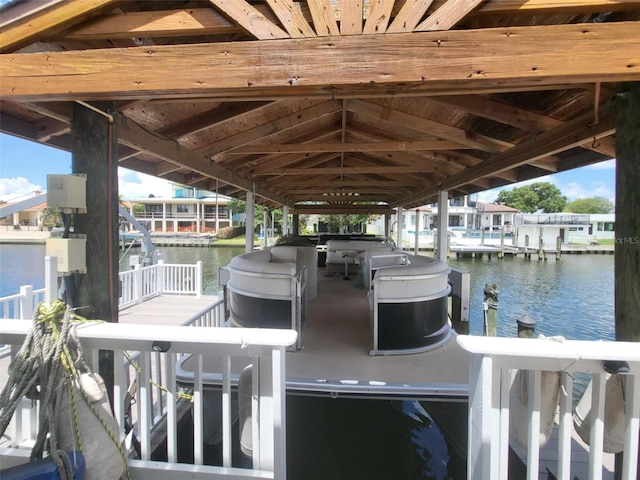 3912 Fontainebleau Dr, Tampa, FL 33634 - view of dock featuring boat lift and a water view