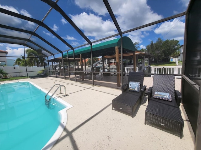 view of pool featuring a patio and a lanai