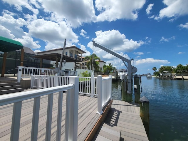 3912 Fontainebleau Dr, Tampa, FL 33634 - view of dock featuring a water view and boat lift